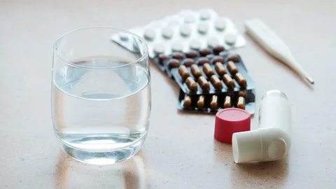 Glass of pure water and various medications Stock Footage 95332553