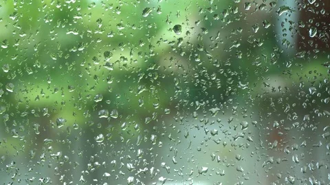Glass with raindrops on a green background Stock Footage 120518839