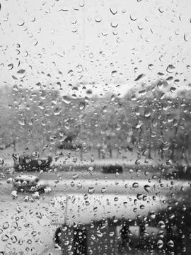 Glass in raindrops Stock Photos