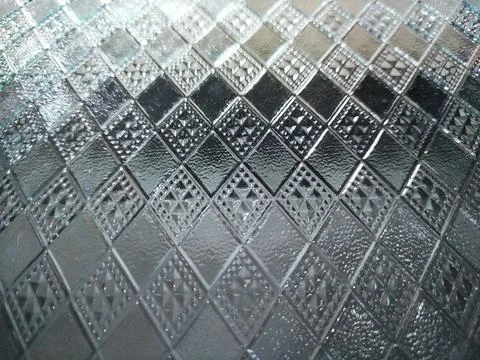 Glass with a raised square pattern template background Stock Photos
