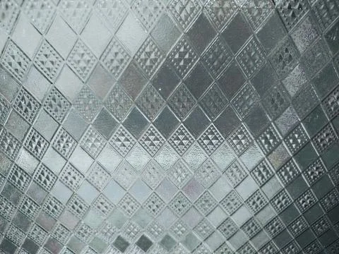 Glass with a raised square pattern template background Stock Photos