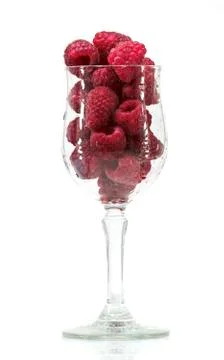 Glass with raspberrys in a white background Stock Photos