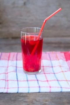 A glass of red cherry compot Stock Photos