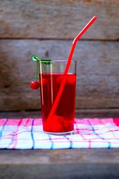 A glass of red cherry compot Stock Photos