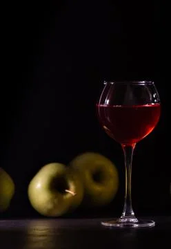 A glass of red fruit wine isolated on black. Stock Photos