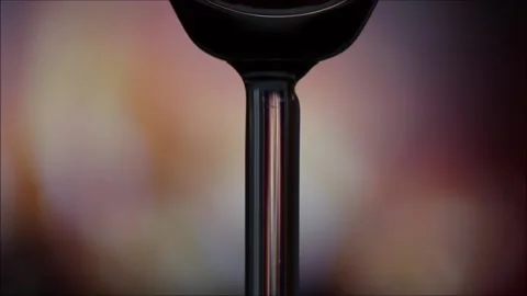 Glass of red wine in front of the fireplace Stock Footage 145709560