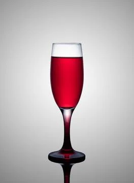 A glass of red wine on a gray gradient background Stock Photos