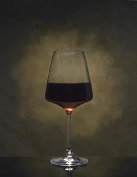 Glass of red wine with reflection Stock Photos