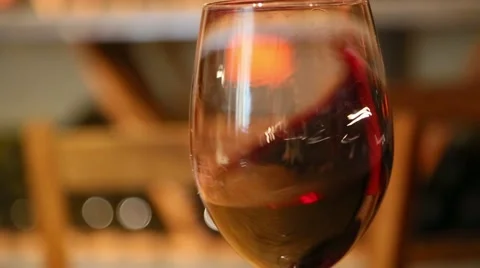 Glass of red wine shaking Stock Footage 52572927
