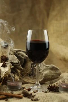 Glass of red wine with spice Foto stock