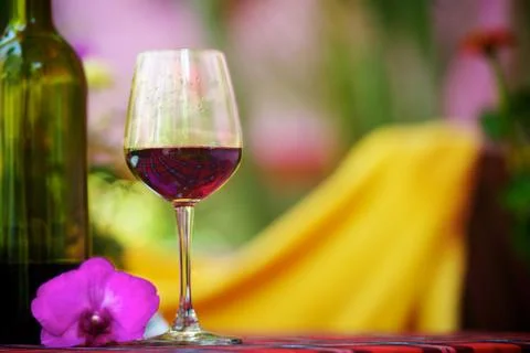 Glass with red wine on the table Stock Photos