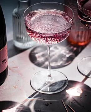 Glass of red wine on a table ready to serve. Cocktail drinks for refreshment. Stock Photos