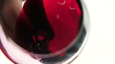 A glass of red wine. White background. Close-up. Stock Footage 217344947