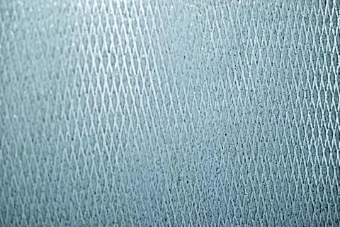 Glass ribbed surface with a triangle pattern Stock Photos
