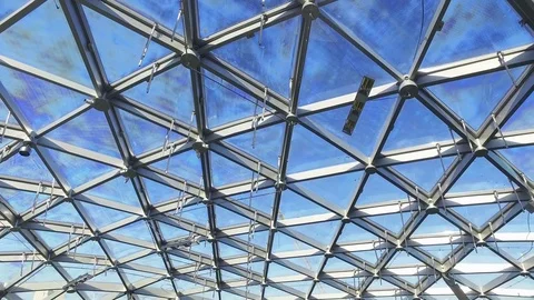 Glass roof of building with views of the sky Stock Footage