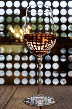 A glass of rose wine on a thin stem with a beautiful unusual ref Stock Photos