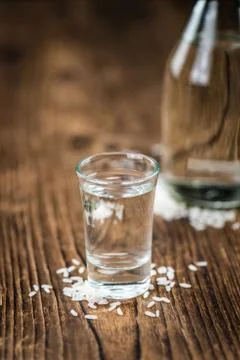 Glass with Sake (selective focus) Stock Photos
