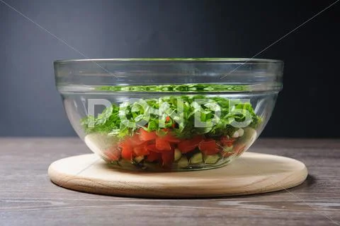 Glass Salad Bowl On A Table