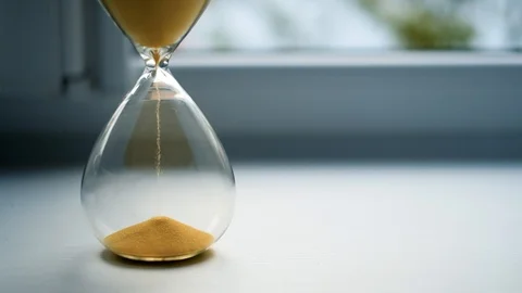 Glass sandwatch with yellow sand Stock Footage 112751953