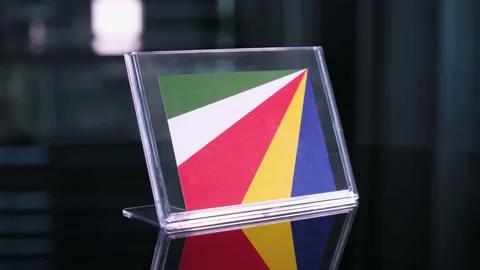 Glass Seychelles Flag Rotating On Table 動画素材 208519914