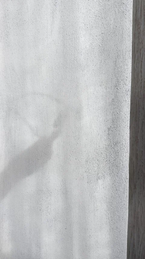 Glass Shadow on Brutalist Concrete Wall with Fading Natural Light Stock Footage 339433500