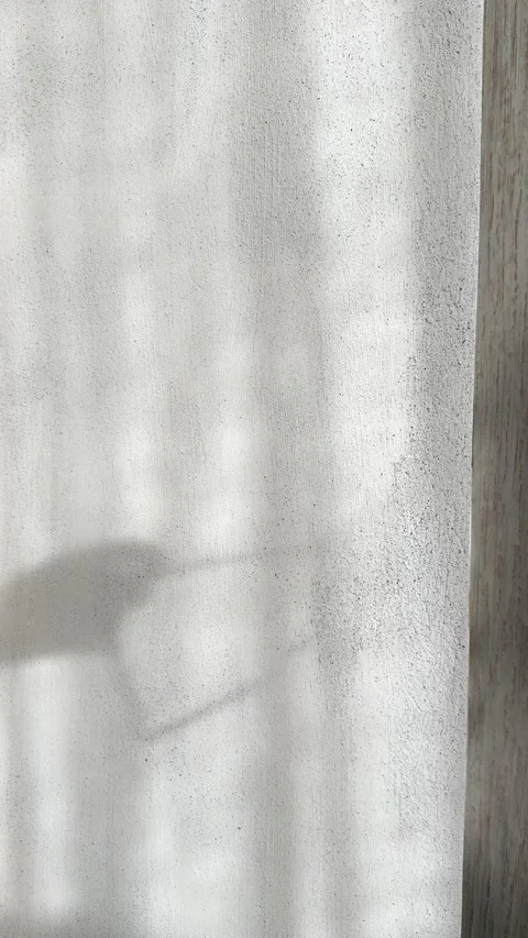 Glass Shadow on Brutalist Concrete Wall in Soft Natural Daylight Vertical Stock Footage 339433690