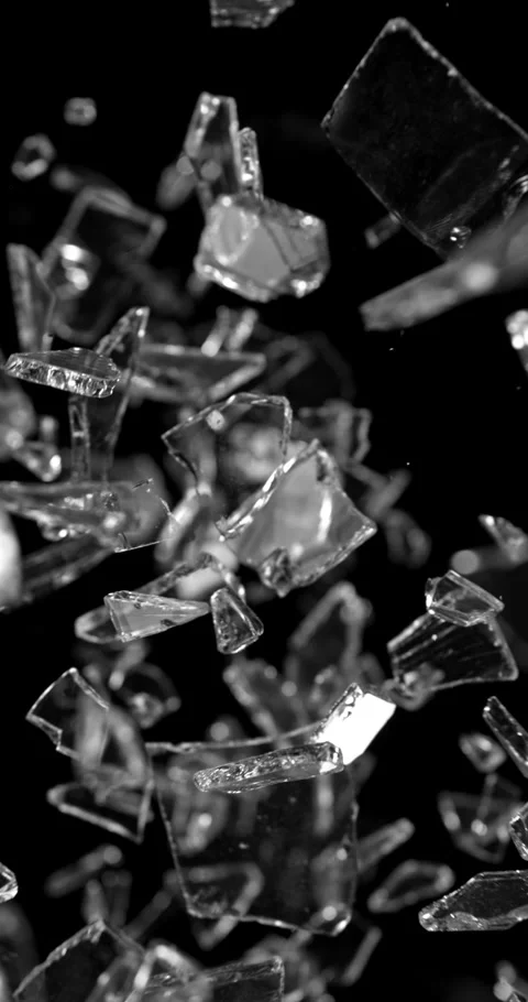 Glass shards exploding and scattering in ultra slow motion at 1000 fps. Stock Footage 323183727