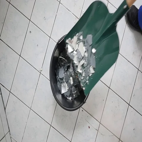 Glass shards getting cleaned up Stock Footage 69281290