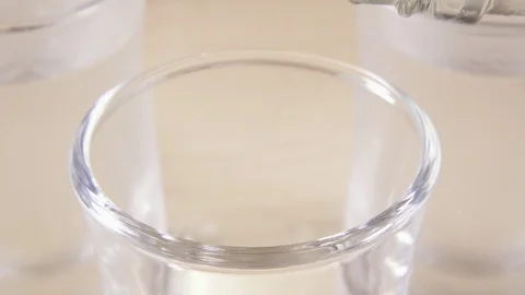 A glass shot on a light table and alcohol Stock Footage 91584611