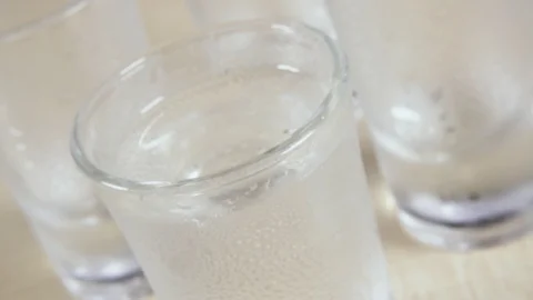A glass shot on a light table and alcohol Stock Footage 91584662