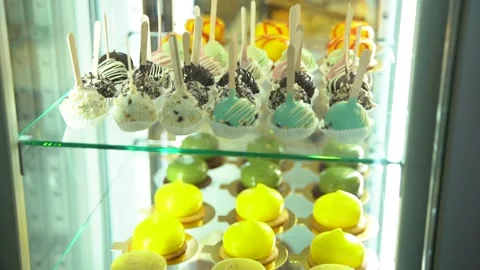 Glass showcase with cakes. Camera moves down Stock Footage 238738464