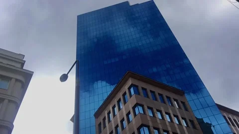 Glass Skyscraper With Dark Clouds Reflection Stock Footage 196741410