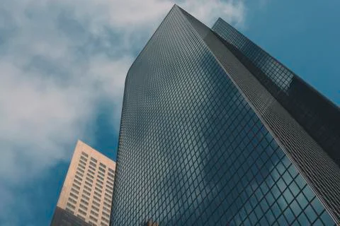 Glass Skyscraper Leading up to the Clouds Stock Photos
