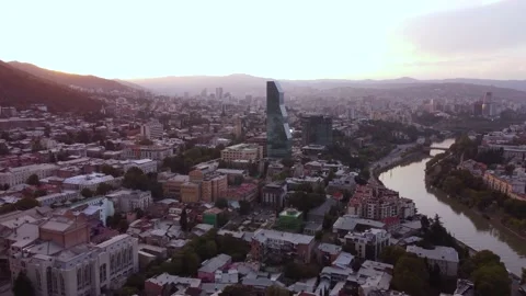 Glass skyscraper in the sunset city Stock Footage 168564397