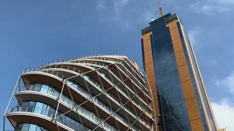 Glass skyscraper towering upward view curved apartment building high rise Видео 343675297