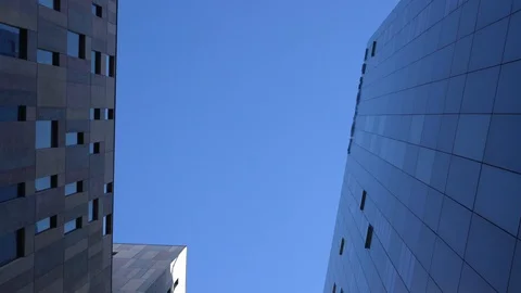 Glass skyscrapers, view from below. the camera rotates slowly Stock Footage 122939166
