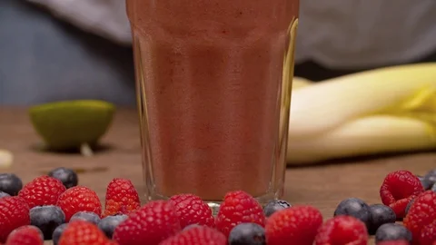 Glass of smoothies on the table Stock-Footage 127616117