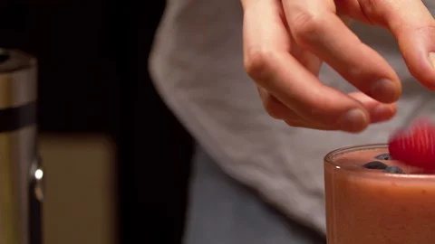 Glass of smoothies on the table Stock Footage 127619868