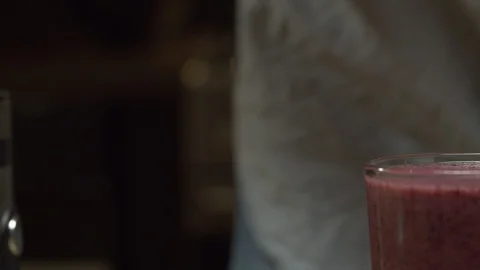 Glass of smoothies on the table Stock Footage 127626676