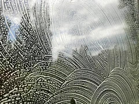 Glass with soapy pattern. Stock Photos