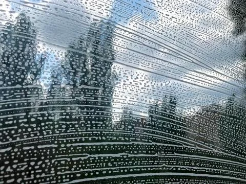 Glass with soapy pattern. Stock Photos