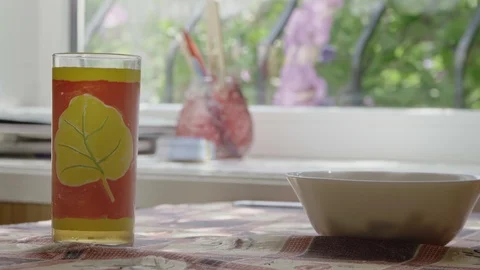Glass with soda on the table in the summer kitchen close-up Stock Footage 126288455