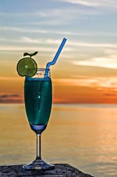 Glass of the soft drink is on a beach table (Maldives, The Indian Ocean) 스톡 사진