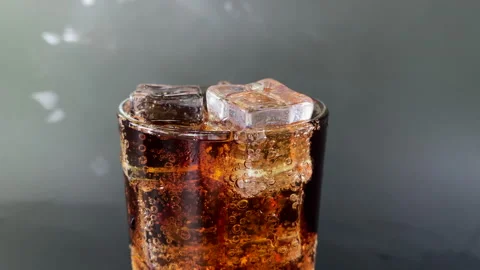 Glass of soft drink in ice Stock Footage 253053427