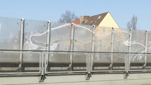 Glass soundproof wall on an elevated road and residential buildings,  Germany Stock Footage 128167309