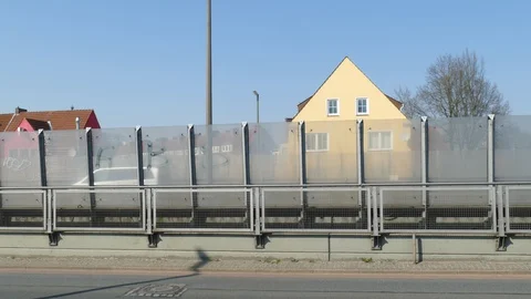 Glass soundproof wall on an elevated road and residential buildings,  Germany Stock Footage 128167335