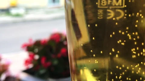 A glass of sparkling beer, an abstract dynamic zoom in Stock Footage 135719994