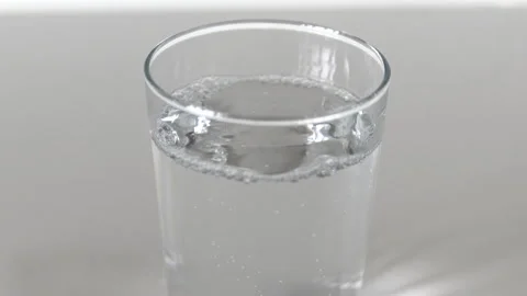 Glass of Sparkling Water featuring Bubbles and Fizz in a Still Glass Stock Footage 267082881
