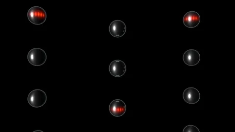 Glass spheres with red lights drifting in rows on black Stock Footage 346779284
