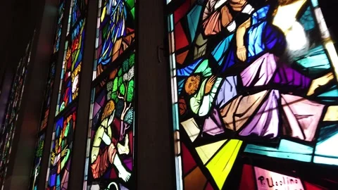 Glass stain window colored in a dark background church coloured with passion and Stock Footage 134166143